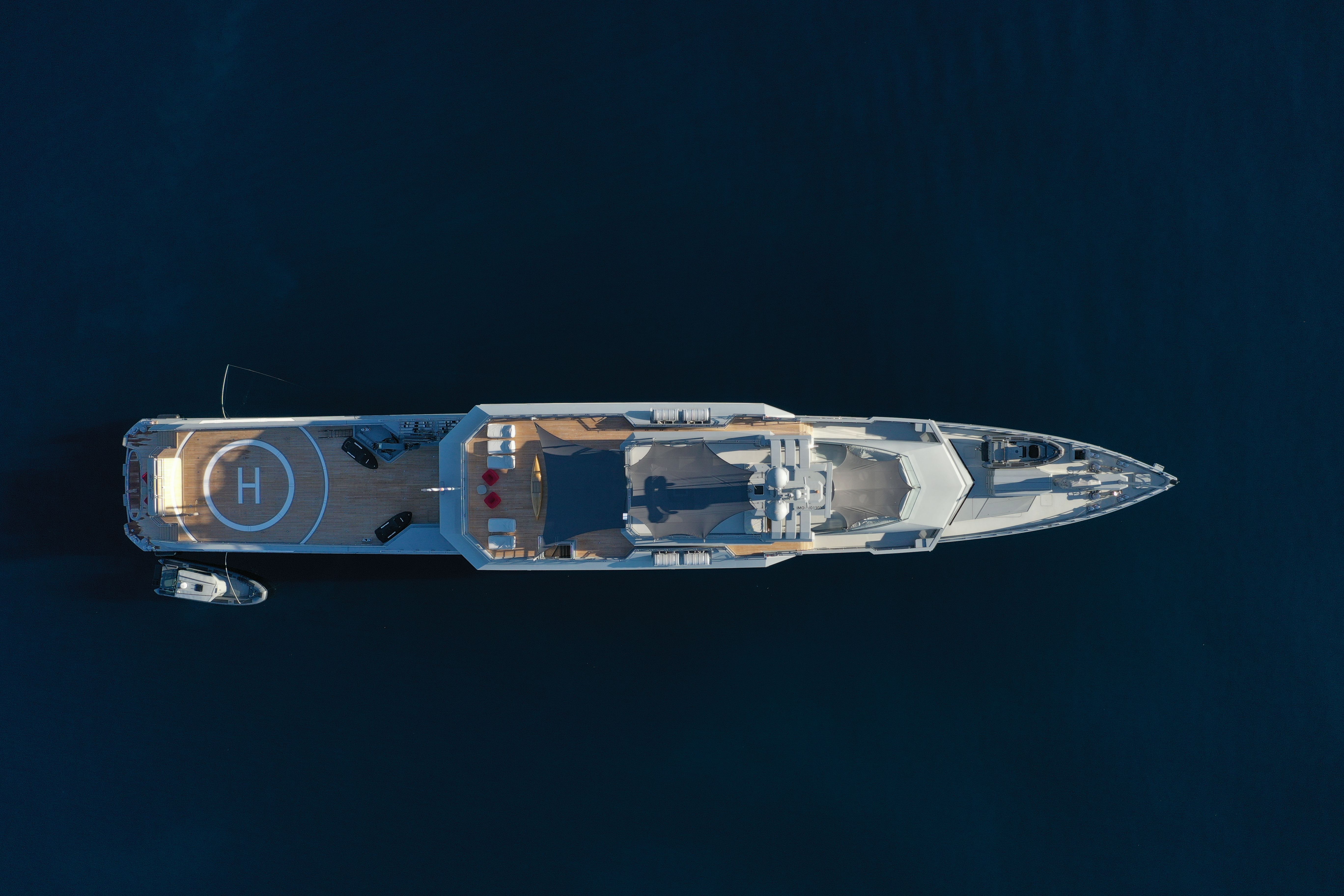 Aerial view of a superyacht at anchor